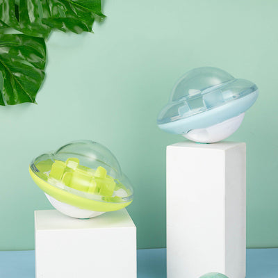 Pet Tumbler Ball Toys in green and blue, featuring a visual cabin, labyrinth damping column, and large opening upper cover for snacks, designed to engage pets physically and mentally