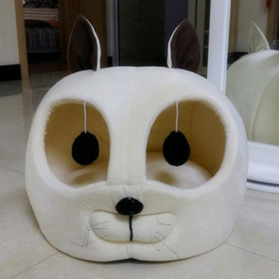 Plush pet bed shaped like a cat, available in beige, white, and dark gray, made from artificial short plush, suitable for cats and small dogs, and machine washable